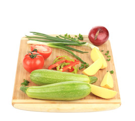Fresh vegetables on cutting board.