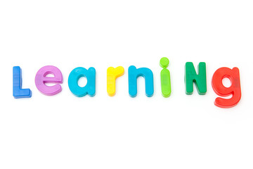 Learning written in magnetic letters.