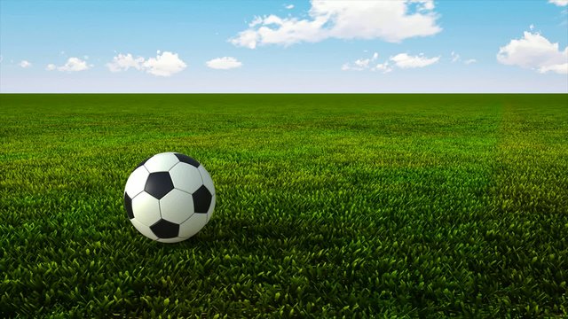 Soccer ball bouncing on green grass HD