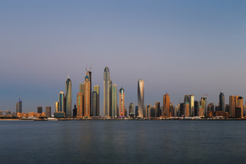 Dubai Marina at dusk as viewed from Palm Jumeirah in Dubai, UAE