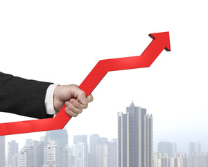 Holding red arrow with city view