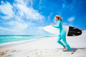 Surfer girl on the beach