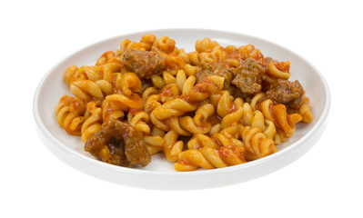 Plate of pasta with sausage in tomato sauce