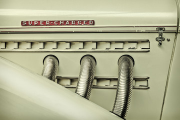 Retro styled image of the side view of a classic car