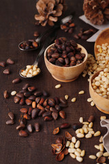 Cedar pine nuts in bowls, on wooden table
