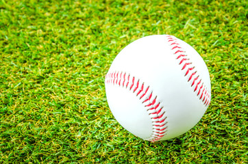 Baseball on green grass