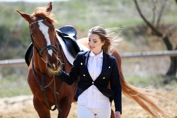 Obraz premium Beautiful girl with horse outdoors