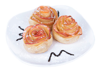 Obraz na płótnie Canvas Tasty puff pastry with apple shaped roses with powdered sugar