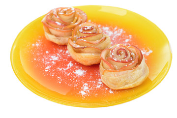 Tasty  puff pastry with apple shaped roses with powdered sugar