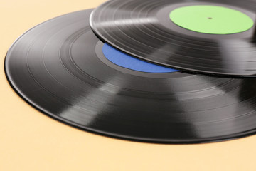 Old vinyl records on brown background