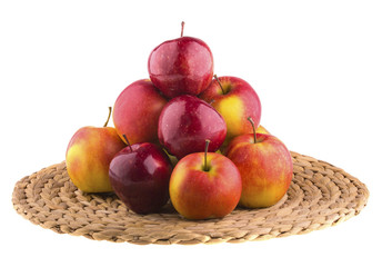 Fresh apples in a wicker baskets, isolated on white background.