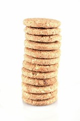 Stack of whole grain cookies isolated on white background
