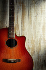 Fototapeta premium western guitar on aged light wood