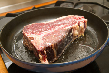 t-bone steak in a pan