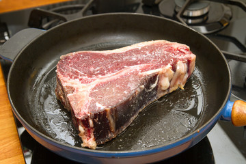 t-bone steak in a pan