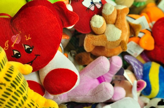Pile of colorful stuffed animal toys for a childs