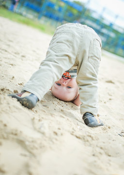 Happy Baby Toddler Standing Upside Down