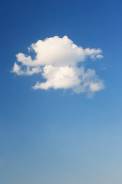 One big cloud and blue clear sky. © Gray wall studio