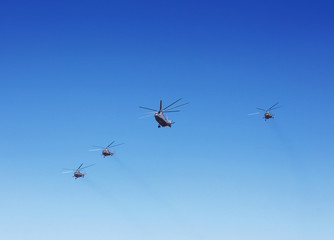 Transport helicopters in flight.