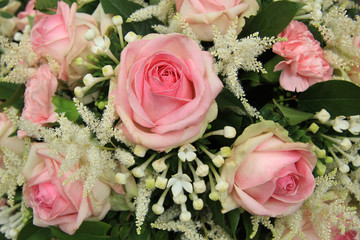 Pink roses and stephanotis in bridal bouquet