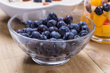 Fresh fruity dessert with bowl of porridge