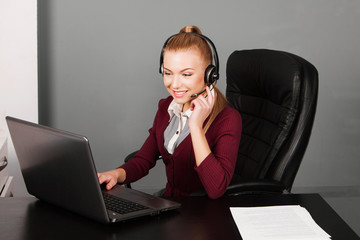happy smiling beautiful support phone operator in headset, at