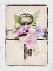 Shabby Chic Background with antique key and flowers