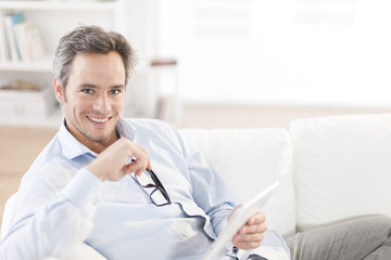 handsome man using a digital tablet