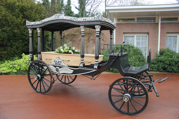 Fototapeta na wymiar Classic funeral carriage with coffin