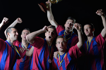 soccer players celebrating victory