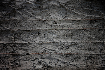 Surface of dark cement in construction.
