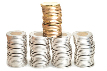 Silver and brass coins stack on white background