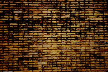 Dark color of old brick wall.