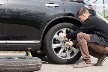 Man changing his spare wheel