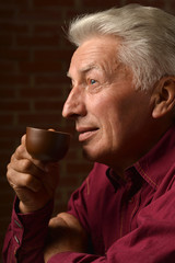 Man with cap of coffee