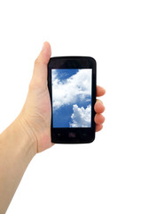 Mobile phone in the hand with blue sky isolated on white