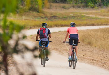 couple cyclist rides on the road