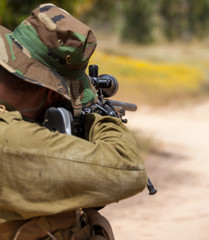 soldier aiming with a sniper rifle