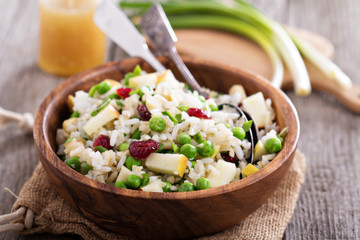 Salad with rice, apple, cranberry and peas