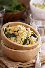 Salad with rice, chickpeas, spinach, raisins