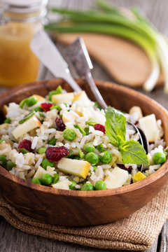 Salad with rice, apple, cranberry and peas