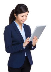 Businesswoman looking at tablet computer