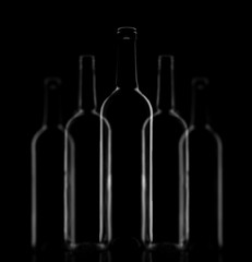 Five glass bottles composition