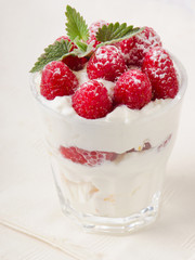 dessert with raspberries and mint leaf