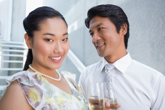 Happy Couple Dressed Up For A Date Having Champagne