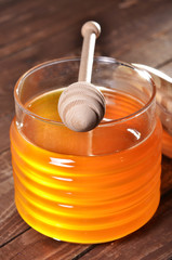 jar with honey and stick for honey