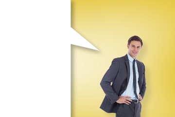 Composite image of smiling businessman with speech bubble