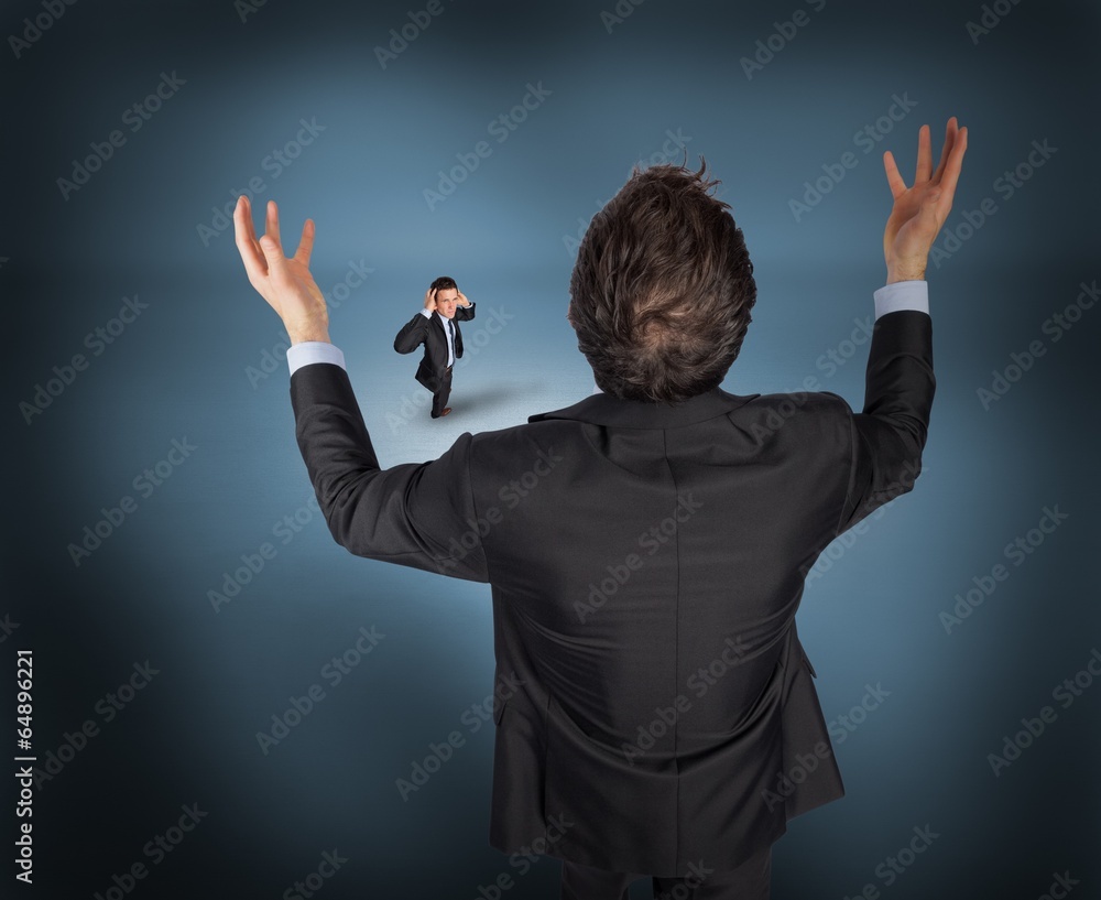 Poster composite image of gesturing businessman with tiny businessman