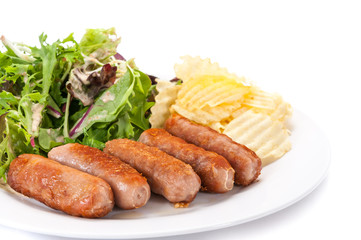 Grilled sausages  vegetables and chips