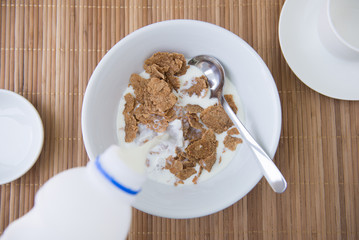 adding milk on cornflake